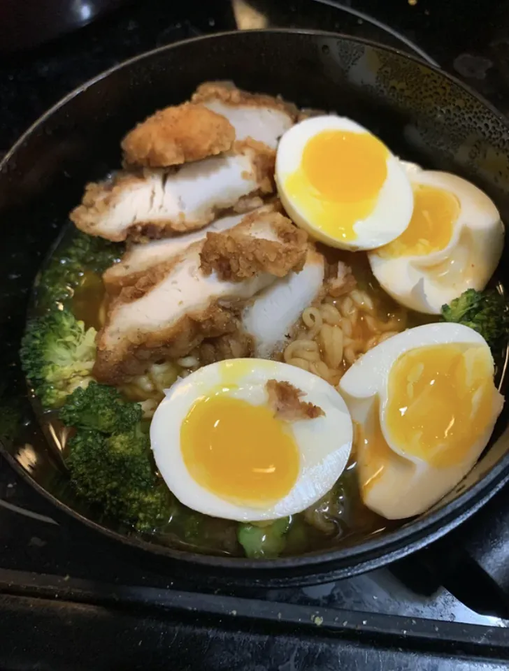 slices of crispy fried chicken, perfectly cooked soft-boiled eggs