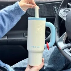 A tumbler in use inside a car